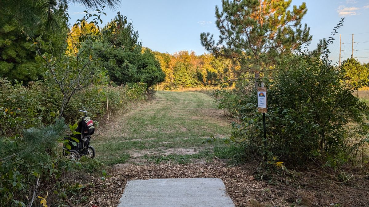 Tee of 7. This is probably my favorite tee shot. It is a very stock hyzer but the downhill makes judging the distance very difficult and a right to left wind is very common here making a hyzer a riskier play.
