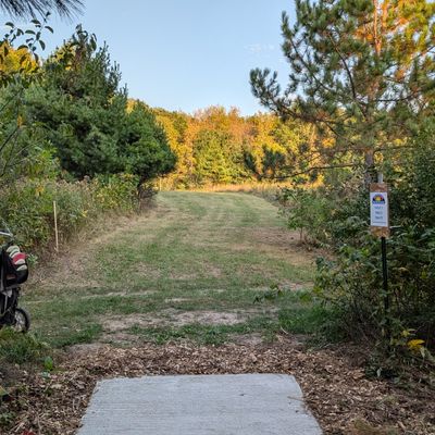 Tee of 7. This is probably my favorite tee shot. It is a very stock hyzer but the downhill makes judging the distance very difficult and a right to left wind is very common here making a hyzer a riskier play.
