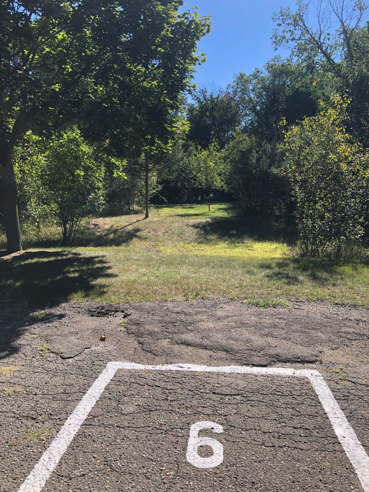 There is a 6th that doesn’t show on UDisc just past 5 marked on the road. Basket is in the woods.