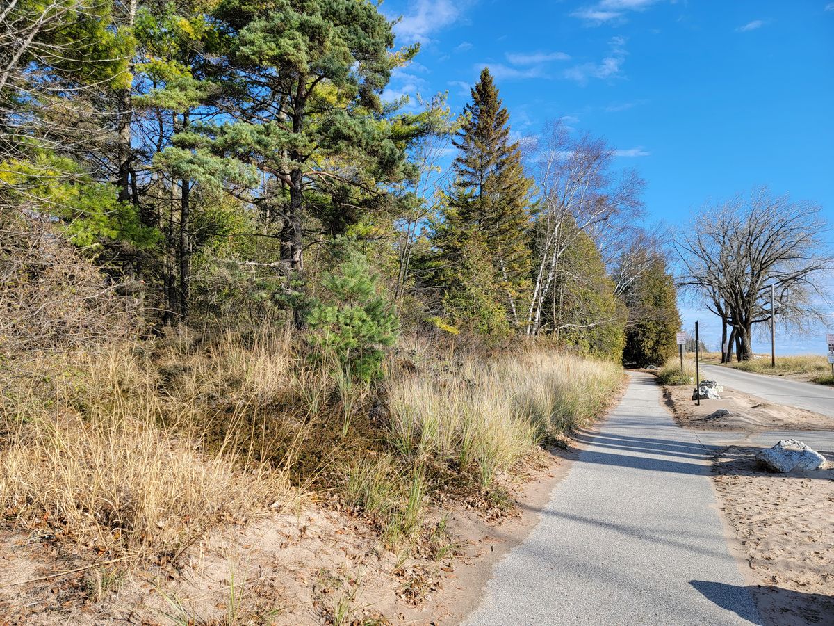 Entrance to hole 1, just North of concession area and across the street from the beach.
