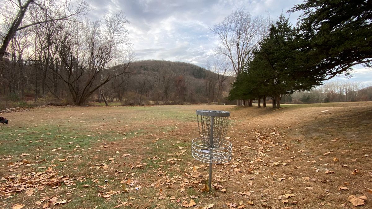 Green of 10 with the Wolf Pit mountain in the background