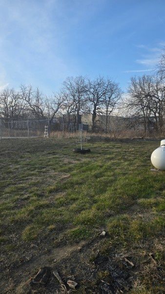 *practice basket, west of big green building*