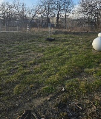 *practice basket, west of big green building*