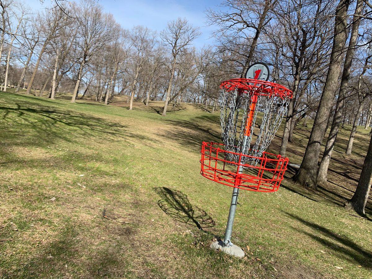 Pin at hole 1. Mature trees & elevation throughout the course.