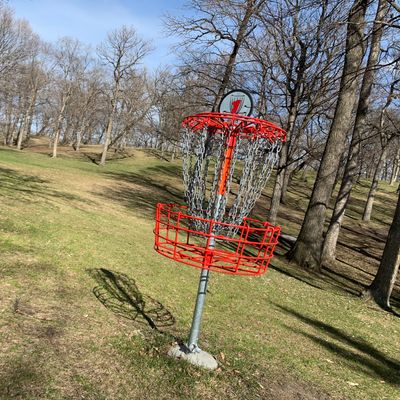 Pin at hole 1. Mature trees & elevation throughout the course.