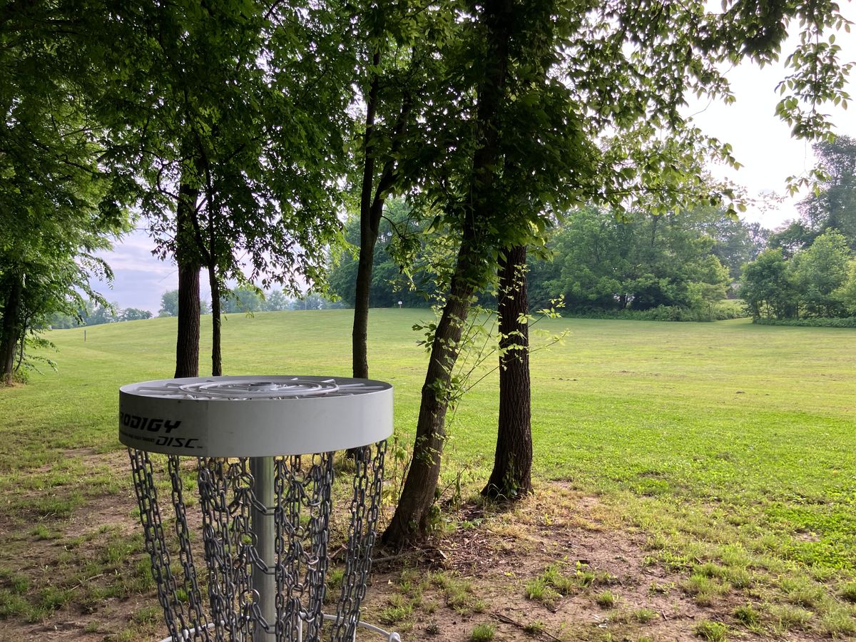 POV of hole 10 basket looking towards tee area.