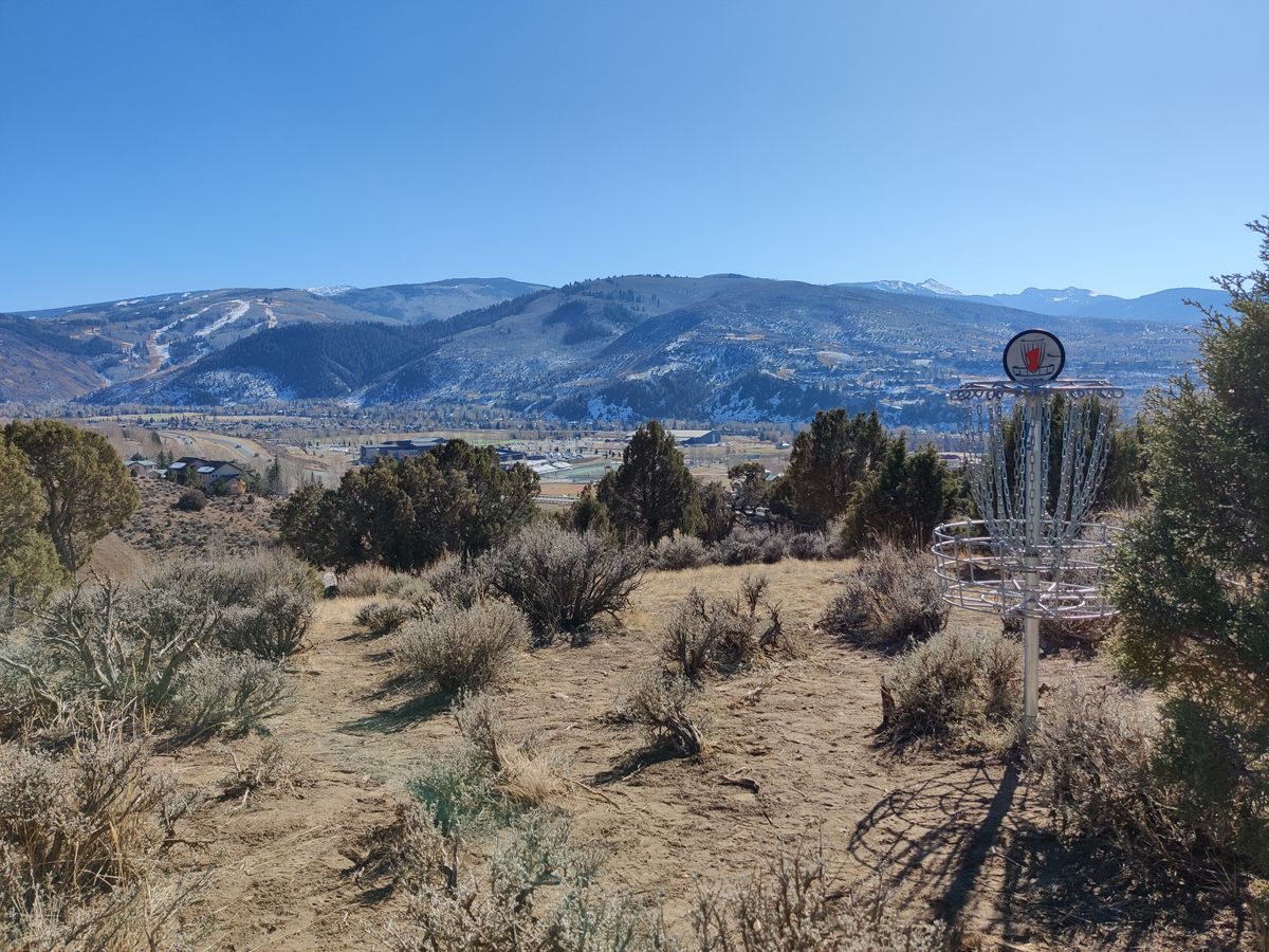 Hole 1 basket, looking South. Top left of picture is Beaver Creek Ski Resort!
