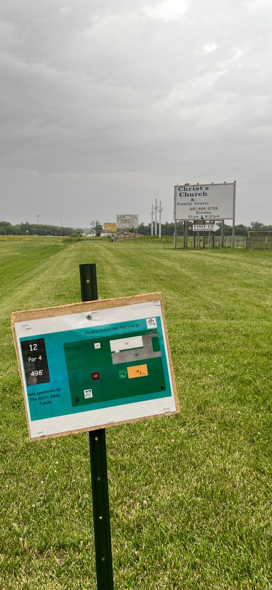 hole 12 sign/pad with landscaping in background