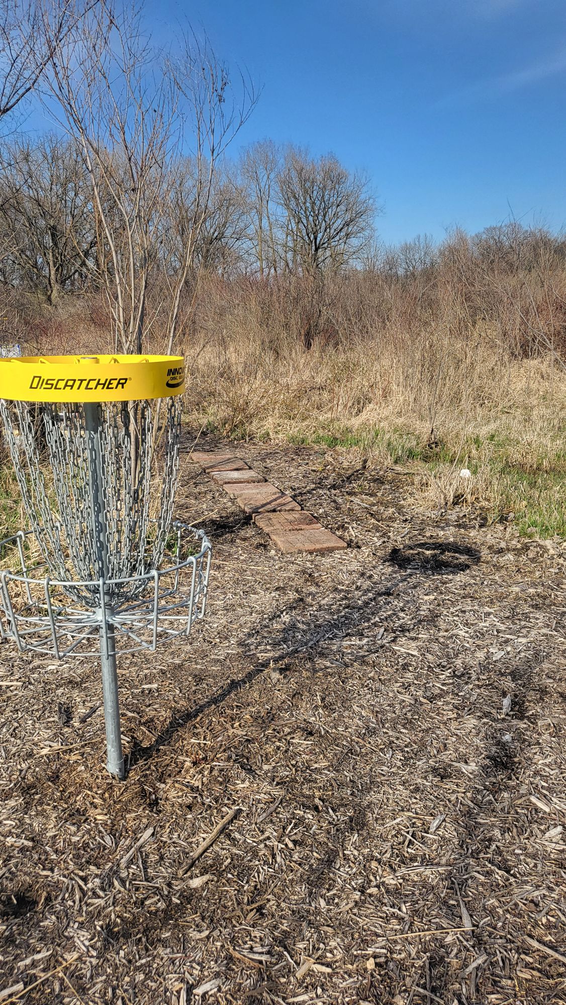 Hole 1 basket and path to hole 2