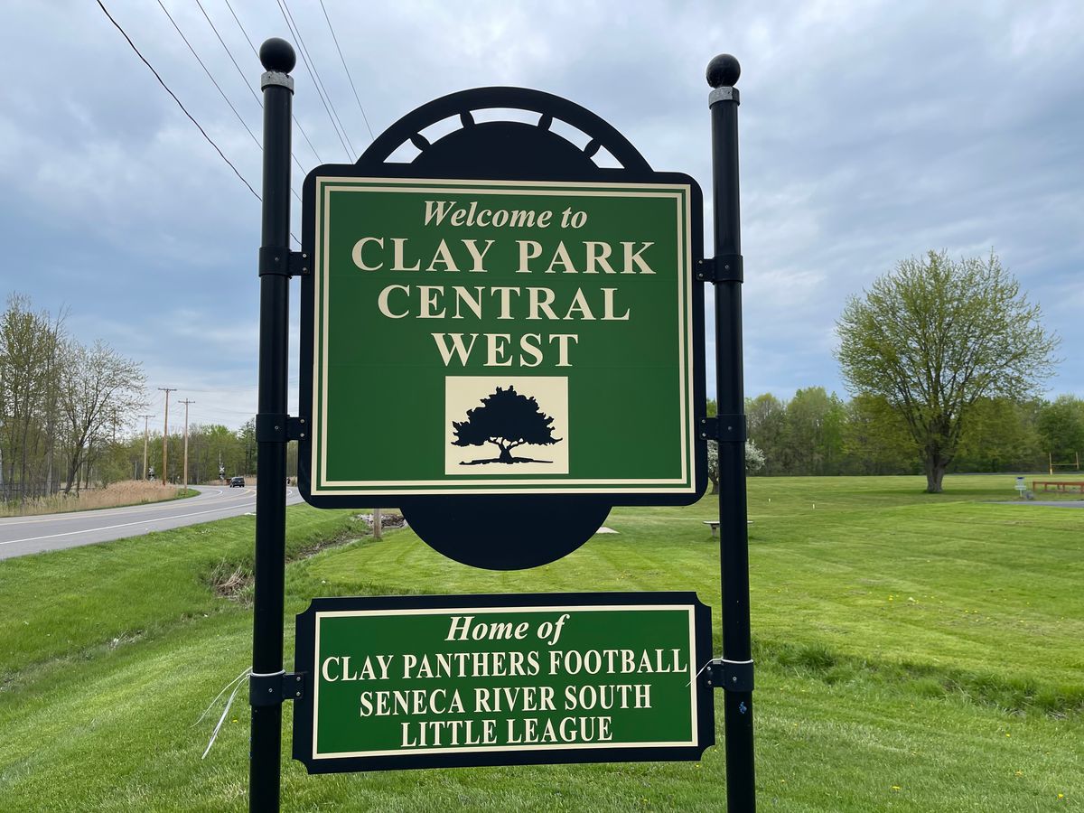 Main Entrance beyond sign