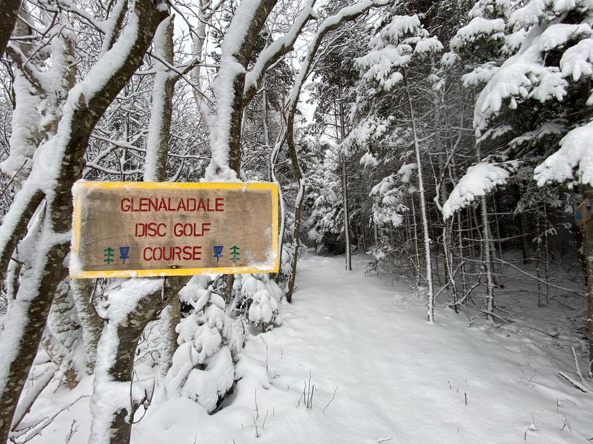 The entrance sign after a fresh snowfall.