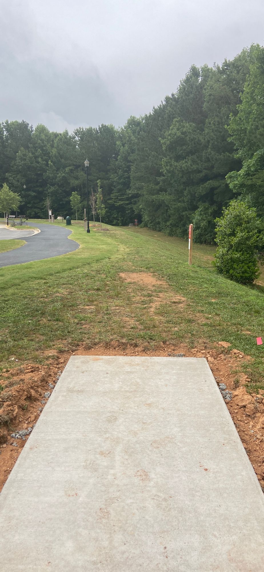 Tee pad 6 view down fairway to basket on far right about 264 feet away