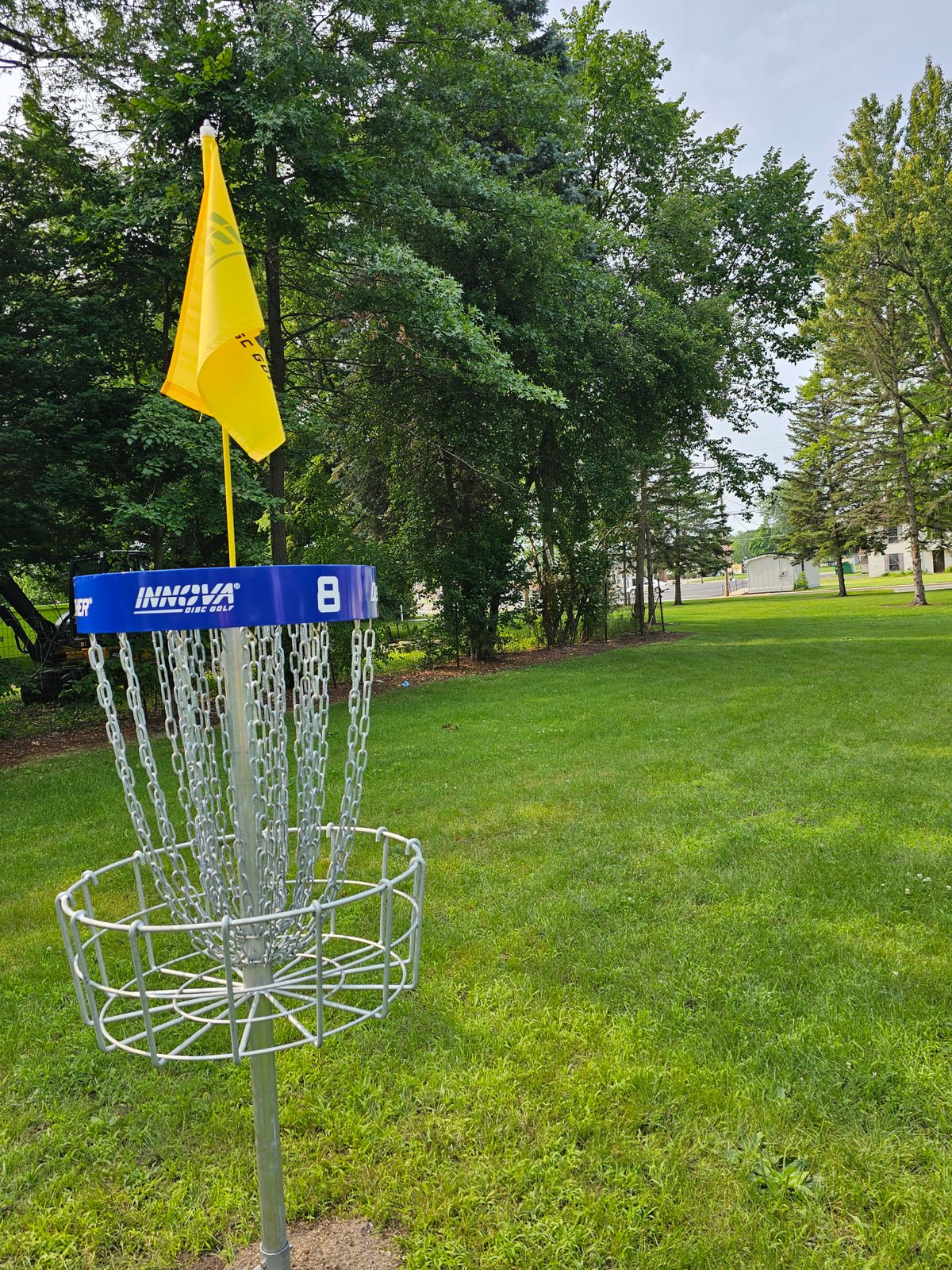 Hole 8 basket to tee. Mando on right, where all the pines and fence are.