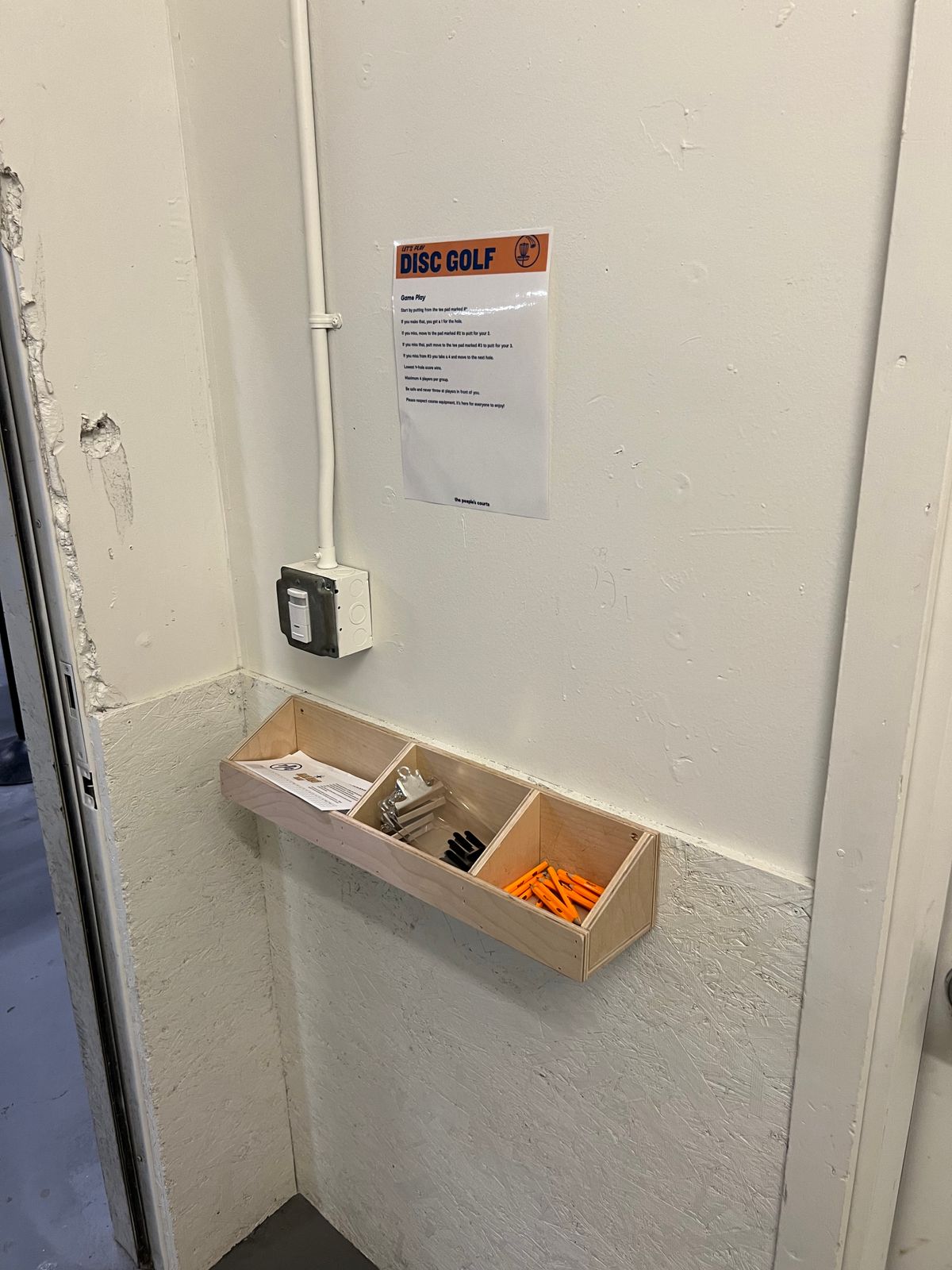 Optional scorecards and pencils at basement entrance
