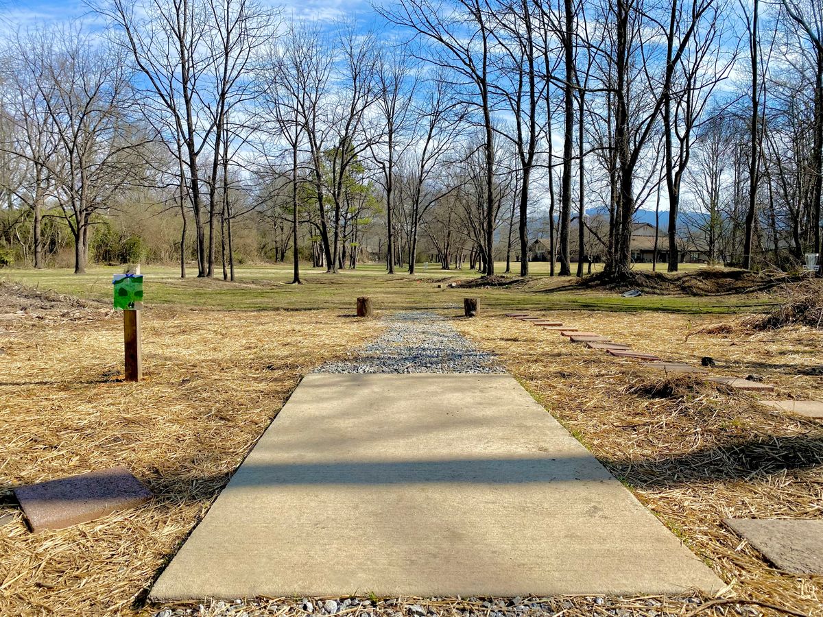 Hole 9’s white tee