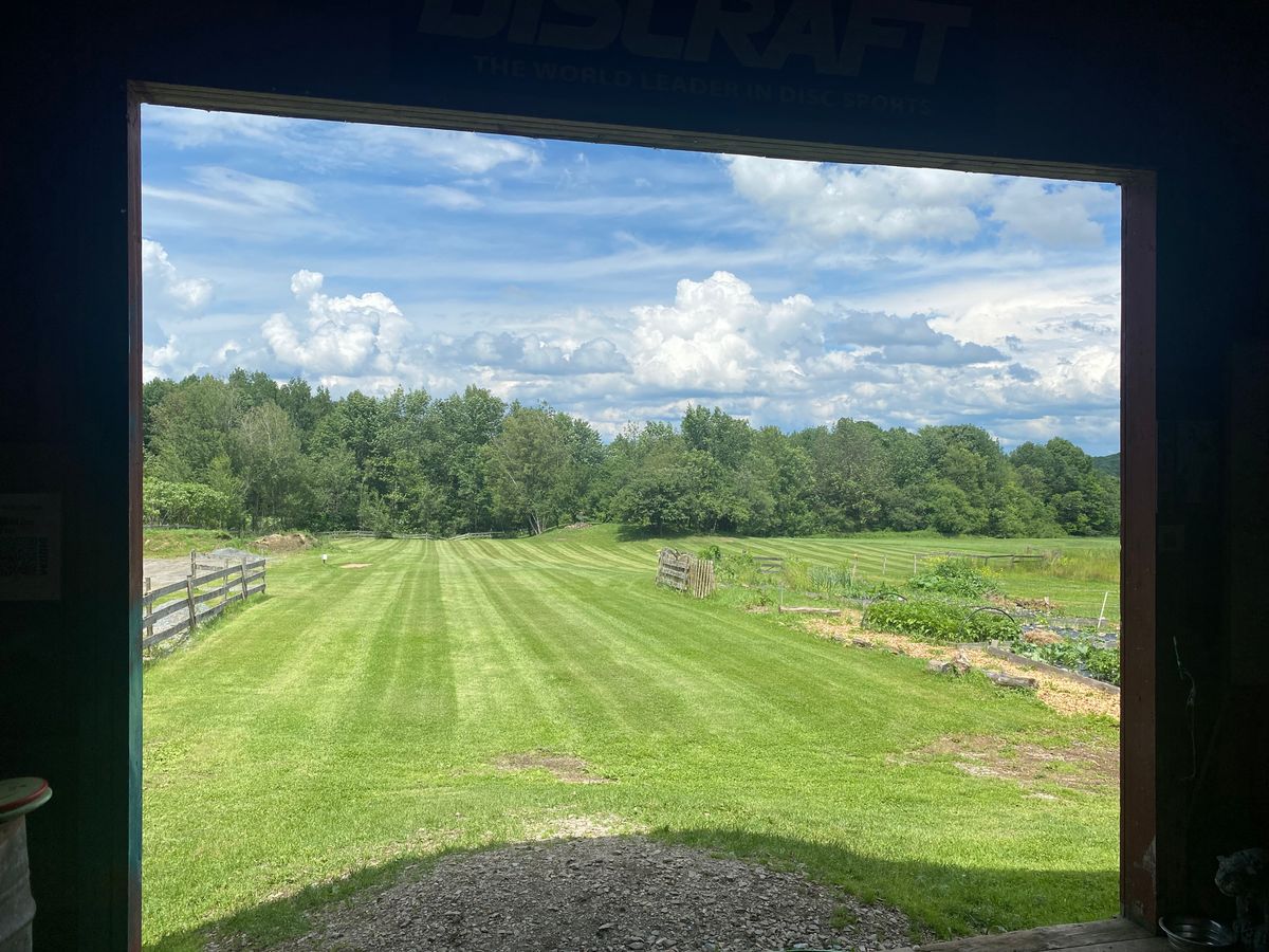 Hole 1 gold tee from the barn