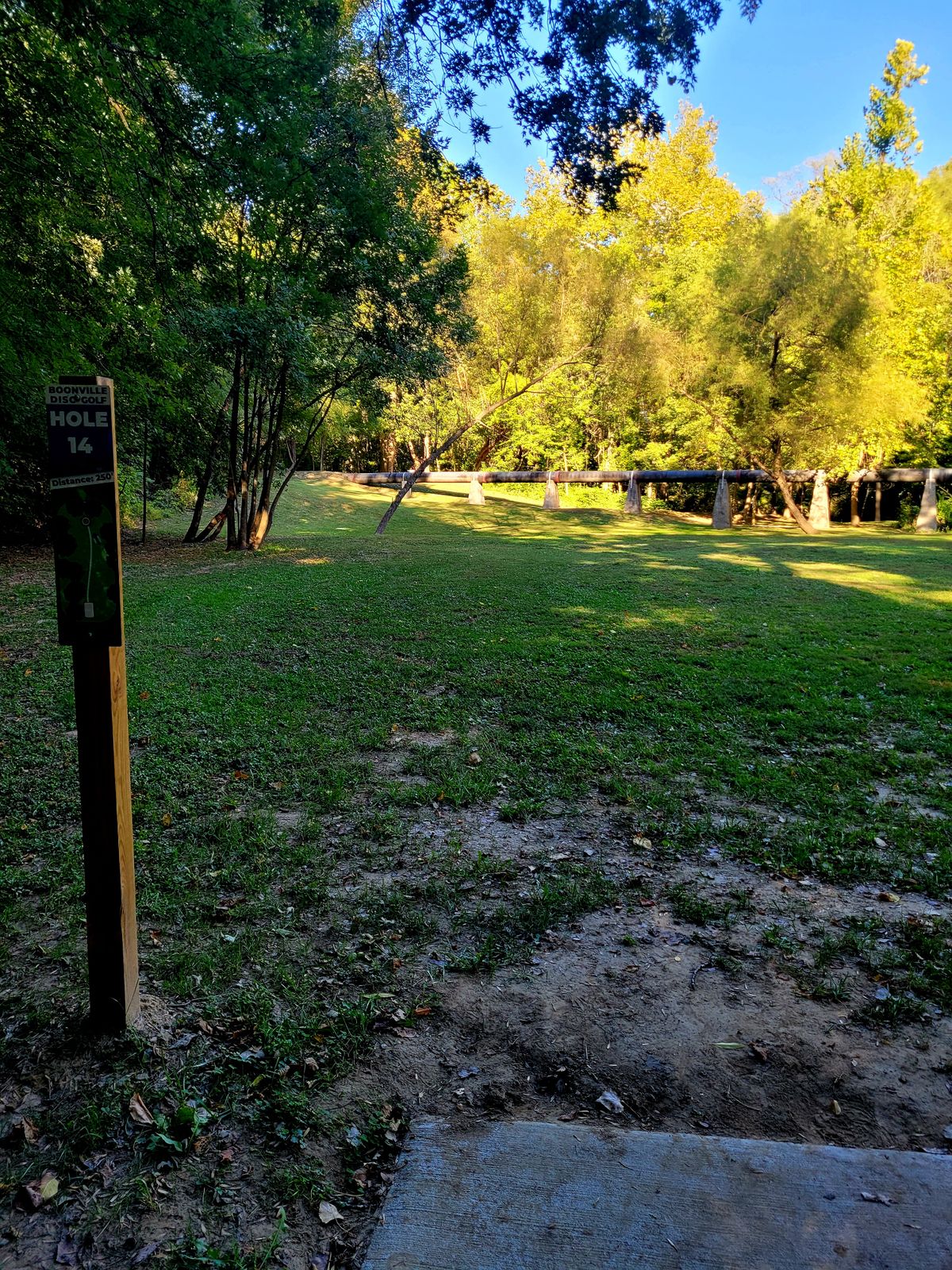 14 Tee shot must go up and over the pipeline.