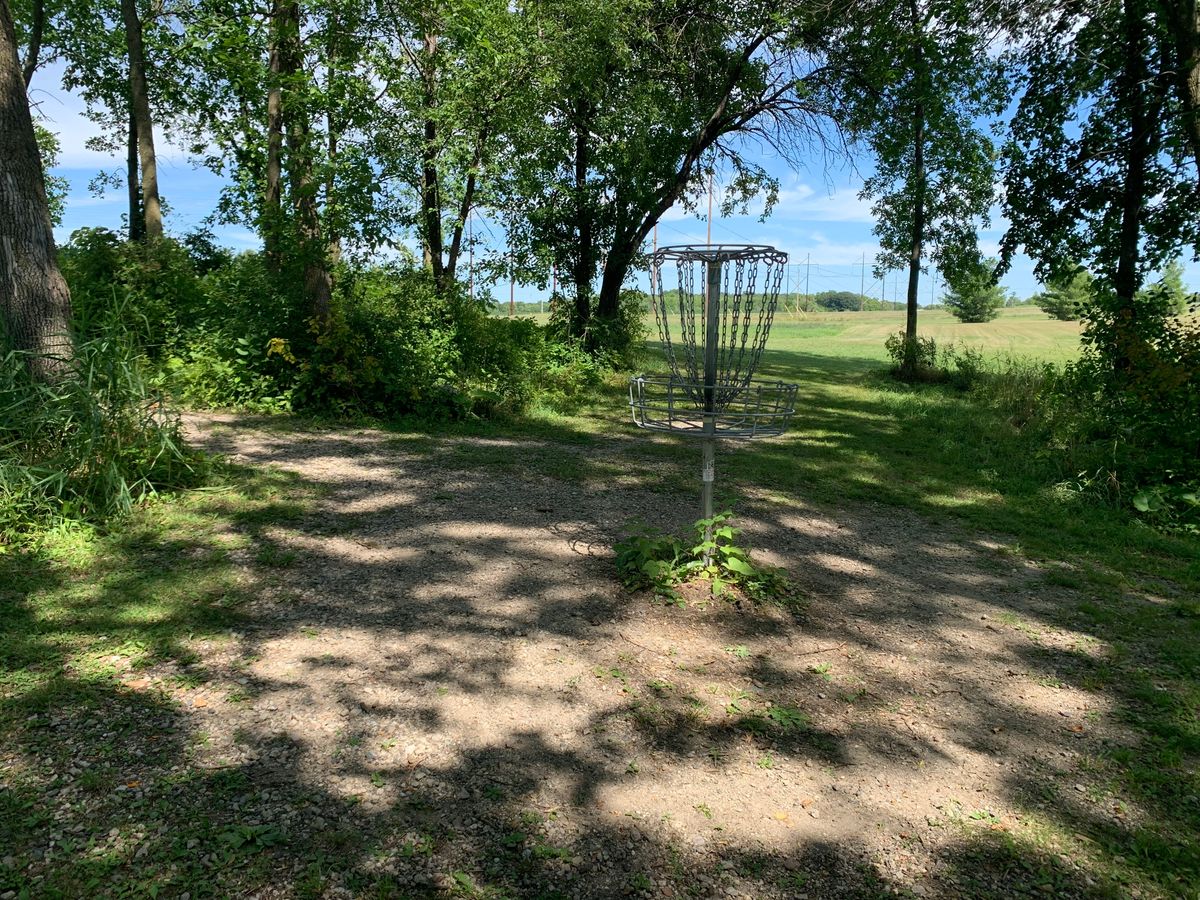 View of hole 2. Fun dogleg hole w/the basket tucked in the woods.