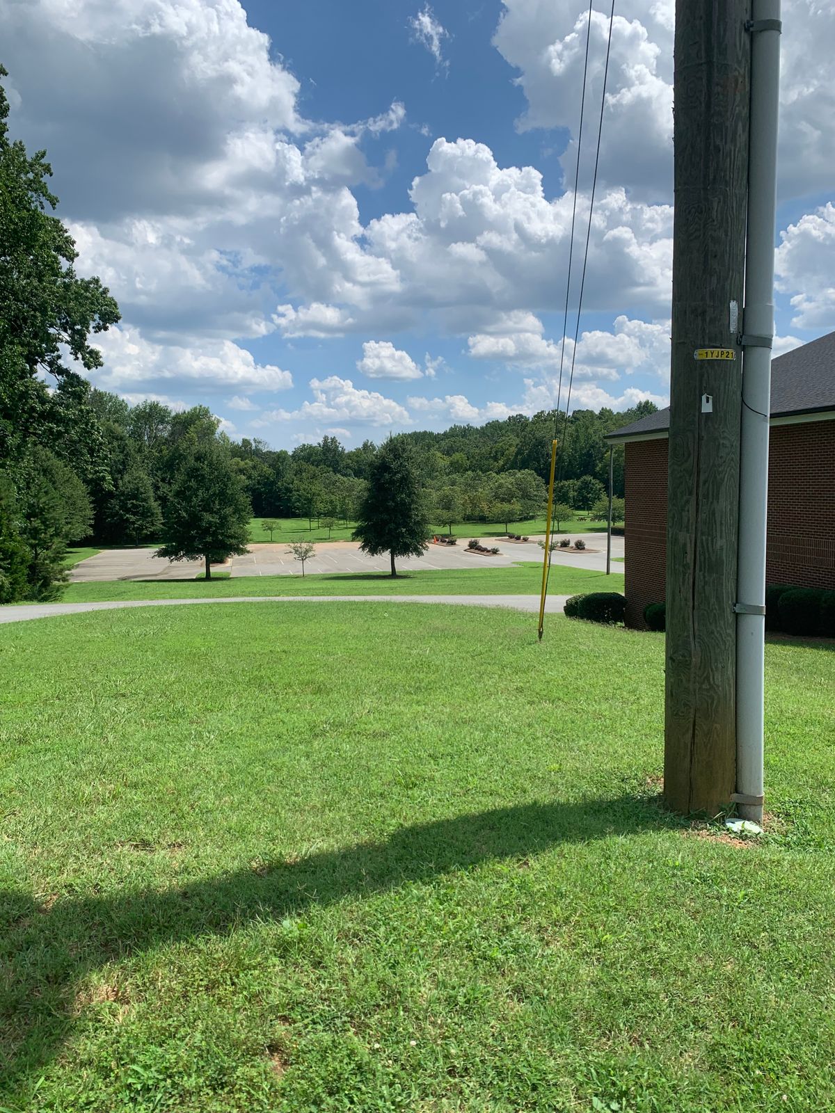 Hole 1 tee location. Next to the telephone pole.
