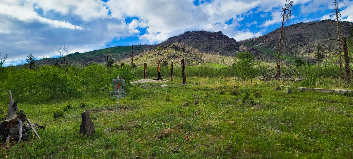 Hole 11 with a beautiful mountain backdrop.