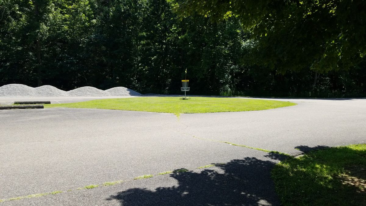 Practice tee in middle of parking lot