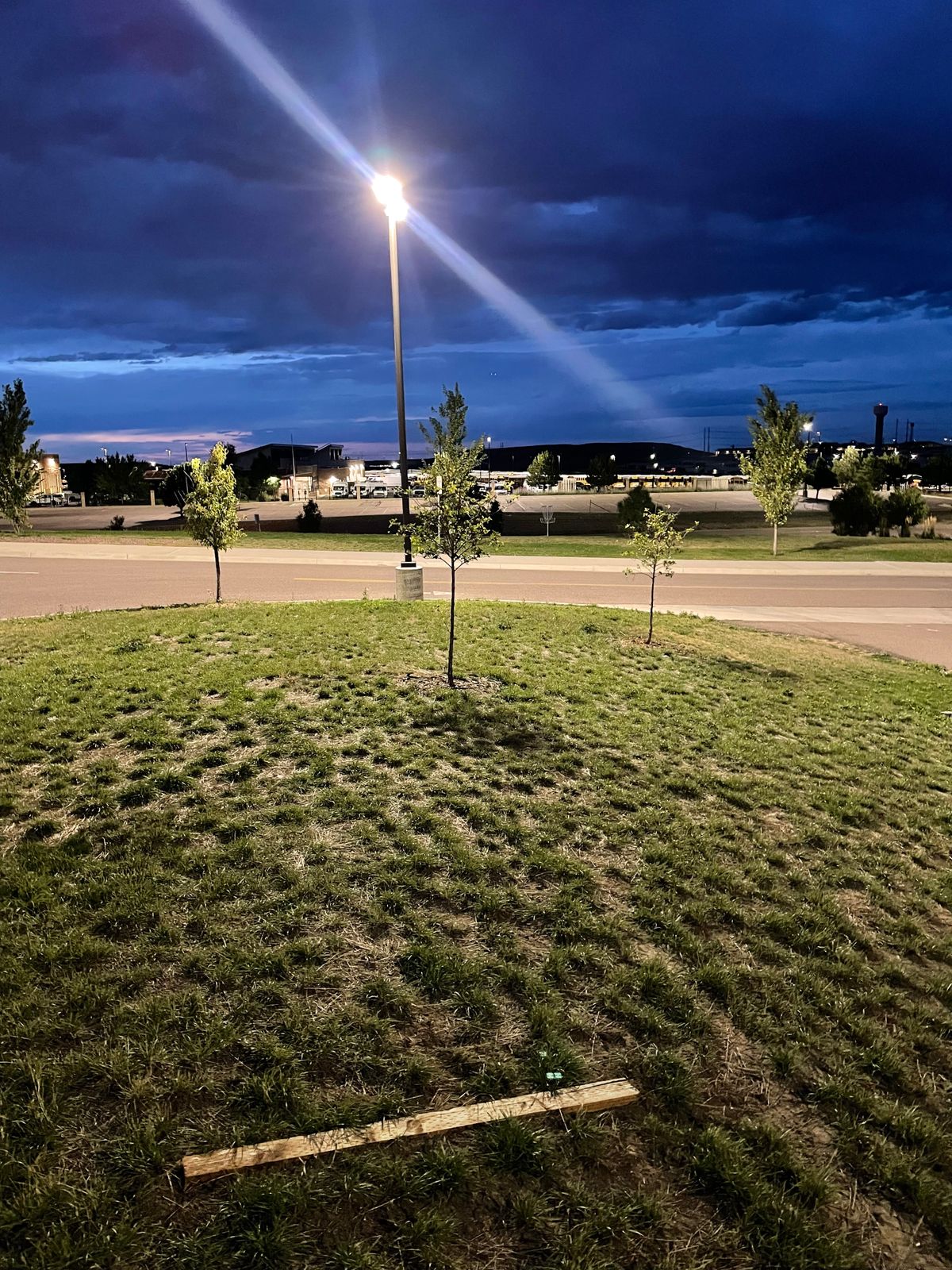 Tee pad for hole 9. Basket is across the school’s road to the right of the street light.