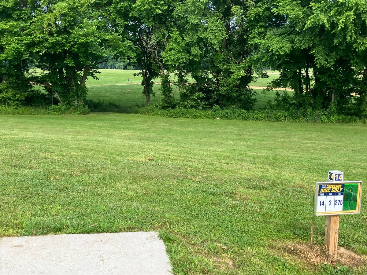 Hole 14 275’ through gap. Creek plays OB.