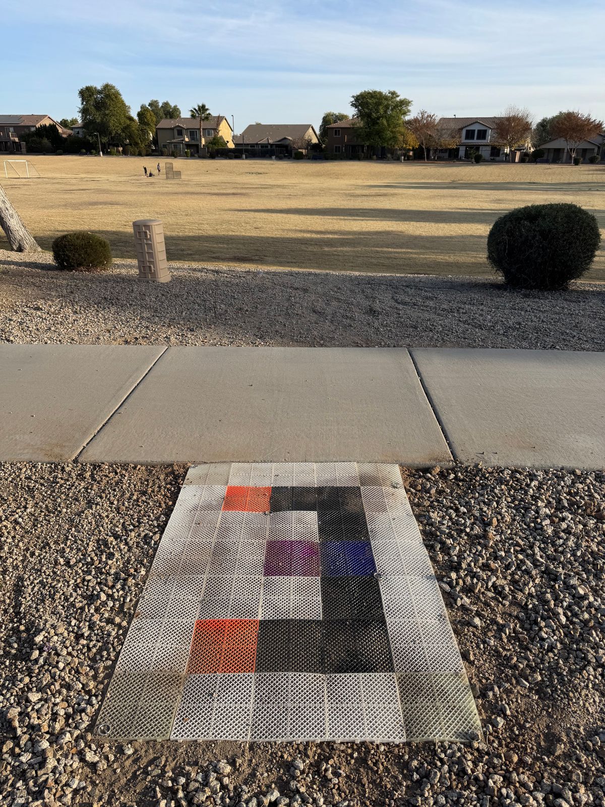 Prototype interlocking tiles to extend tee pad.