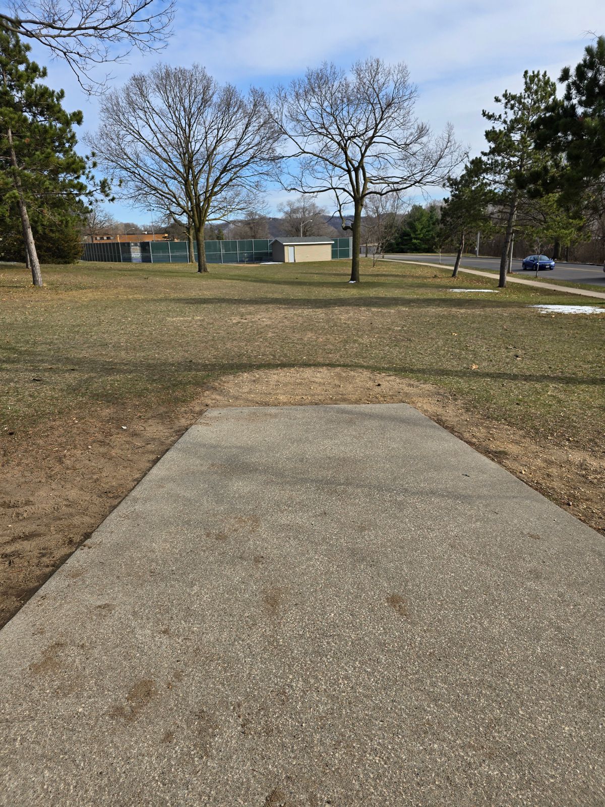 View of hole 1 tee. Basket is center -left.