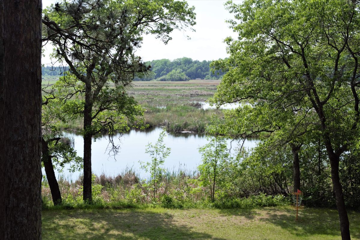 Basket for holes 15 and 18 with Mississippi River beyond.