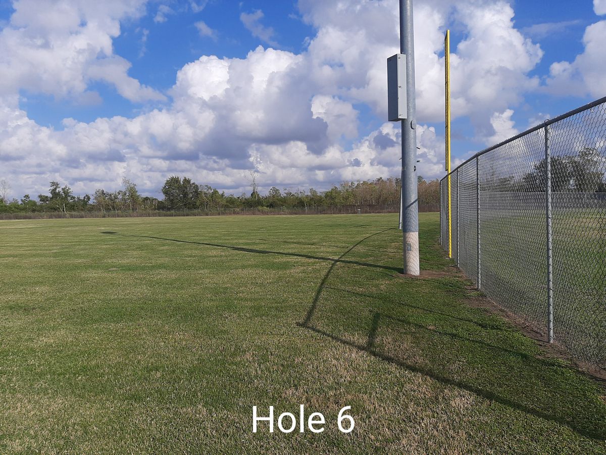 Baseball field and (and airport if you overthrow) is OB. Throw from even with baseball field fence