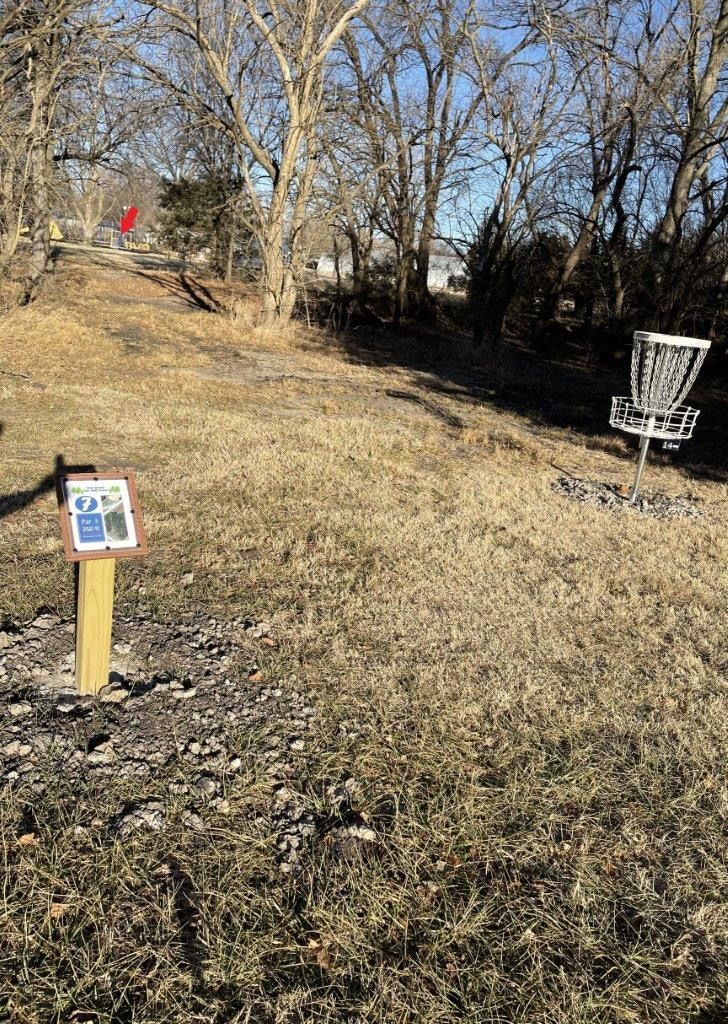 Hole 7 short tunnel shot. Basket at red arrow.