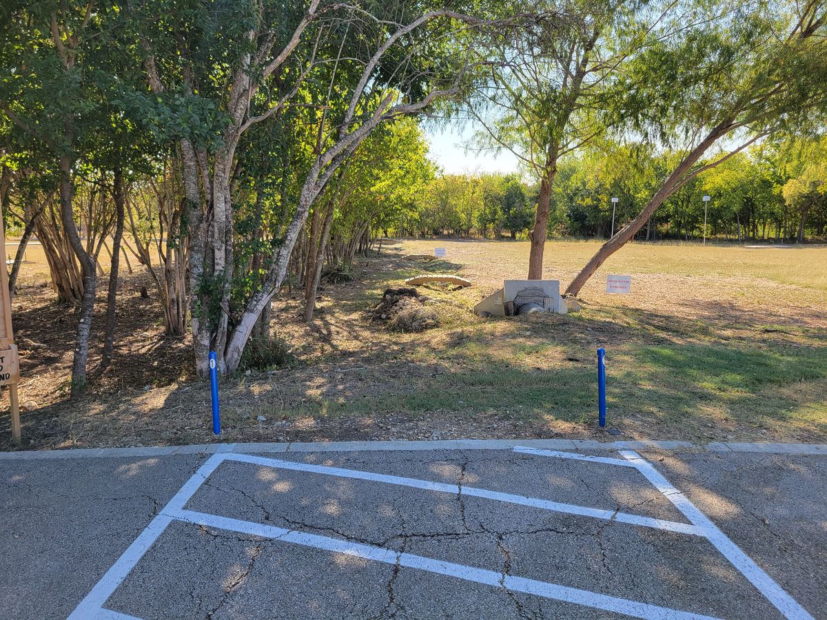 Hole One down tree line and through tree tunnel to the left.