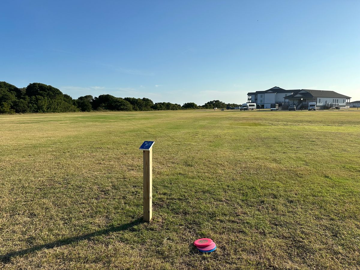Hole 7 tee.  (Basket hidden in trees to the left going into sand dunes.)