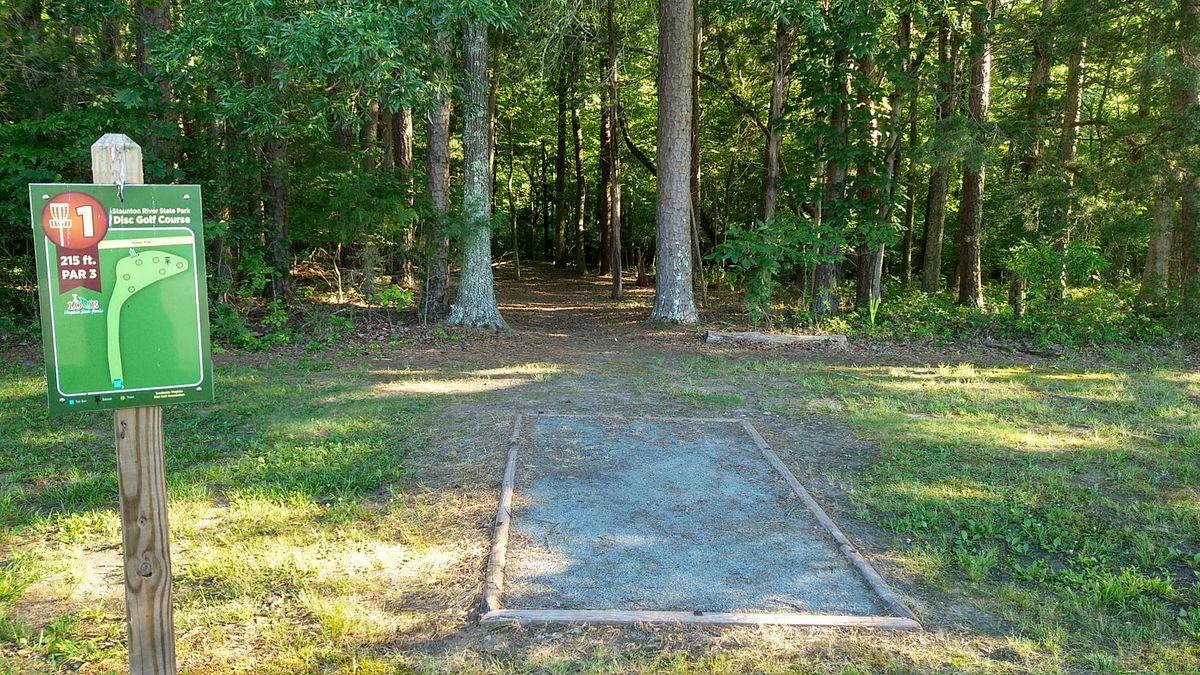 Hole #1. Par 3 - 215 feet. Slightly downhill with a dogleg right.