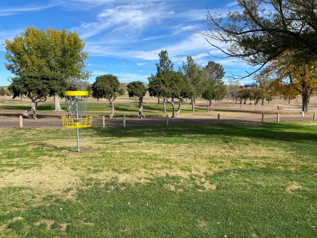 Hole 18 is near the clubhouse. Do you see the red basket in the back? We have 2 courses!