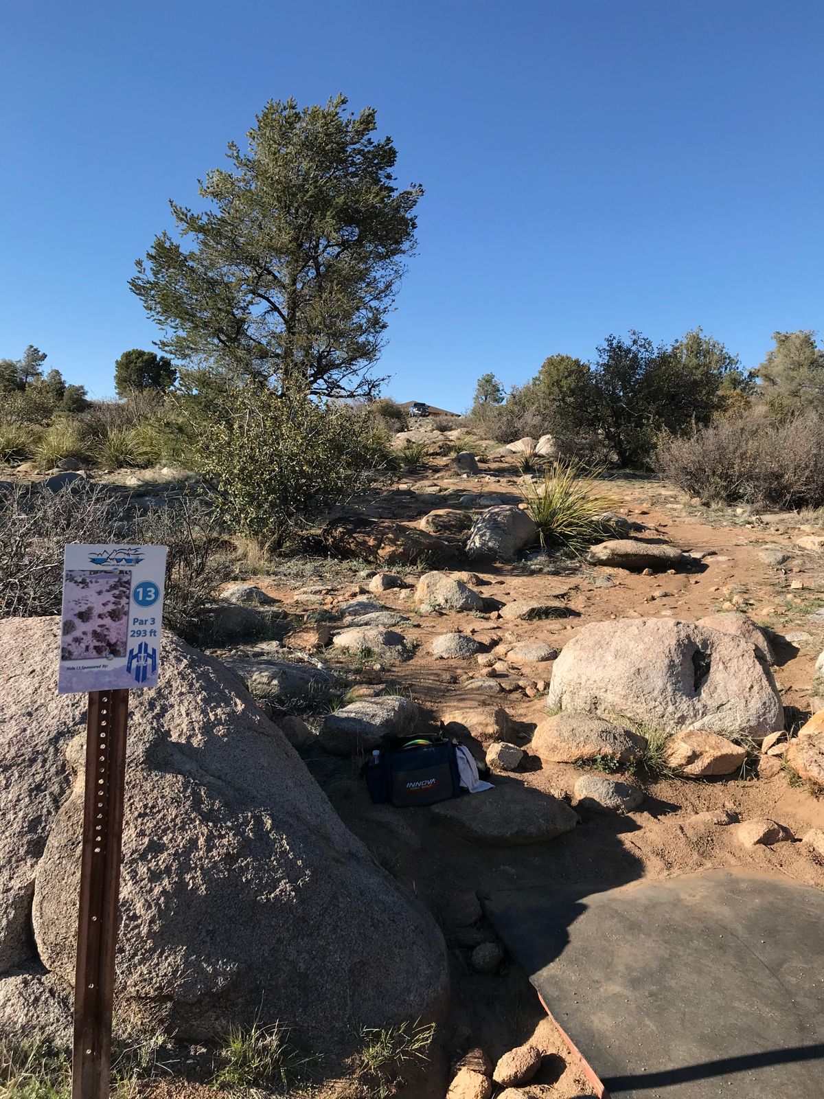 Hole 13 basket near parking lot