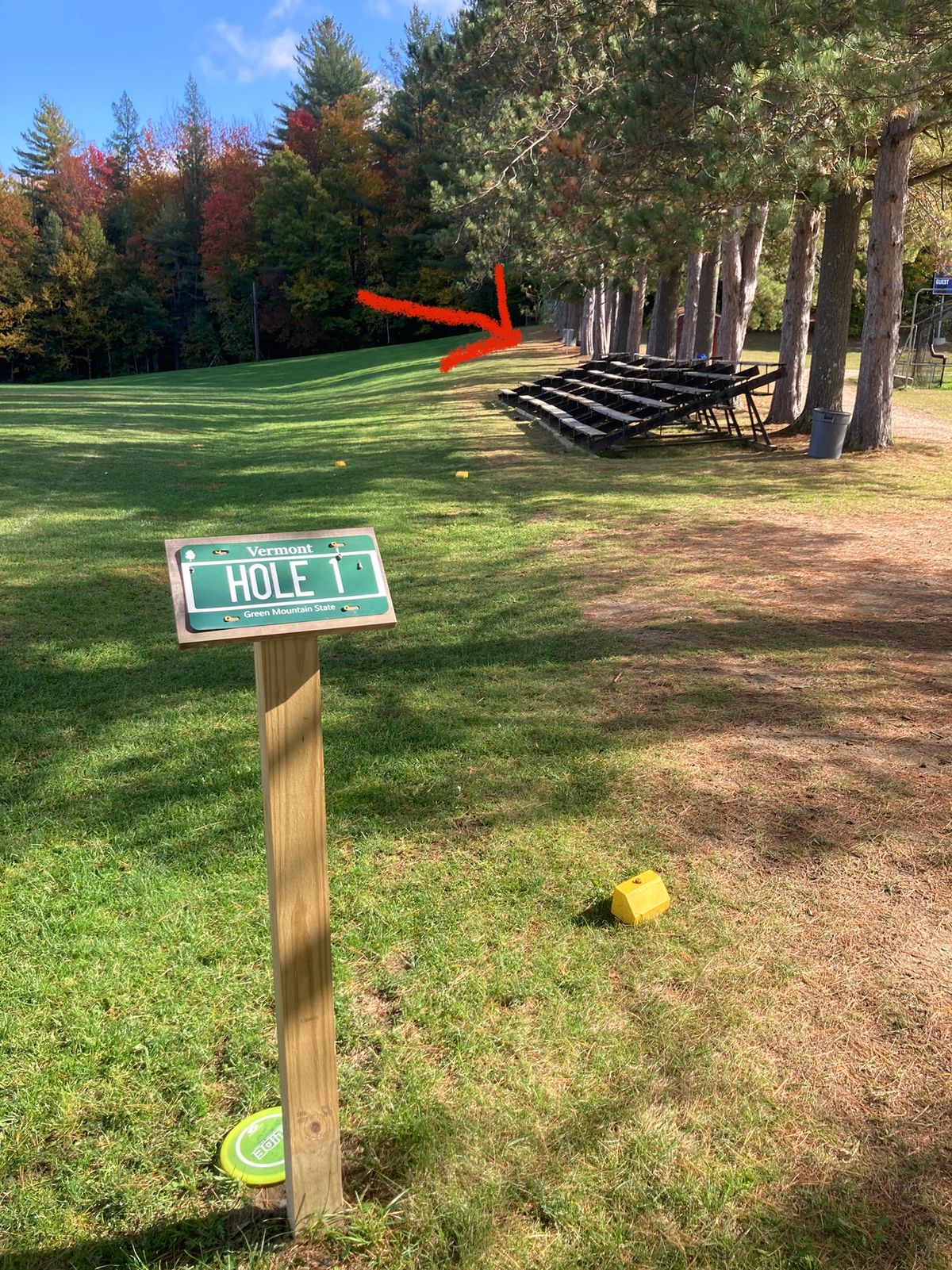 Hole 1 tee (red arrows point to basket)
