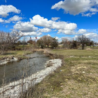 A creek runs next to and through some holes. Potential to lose discs