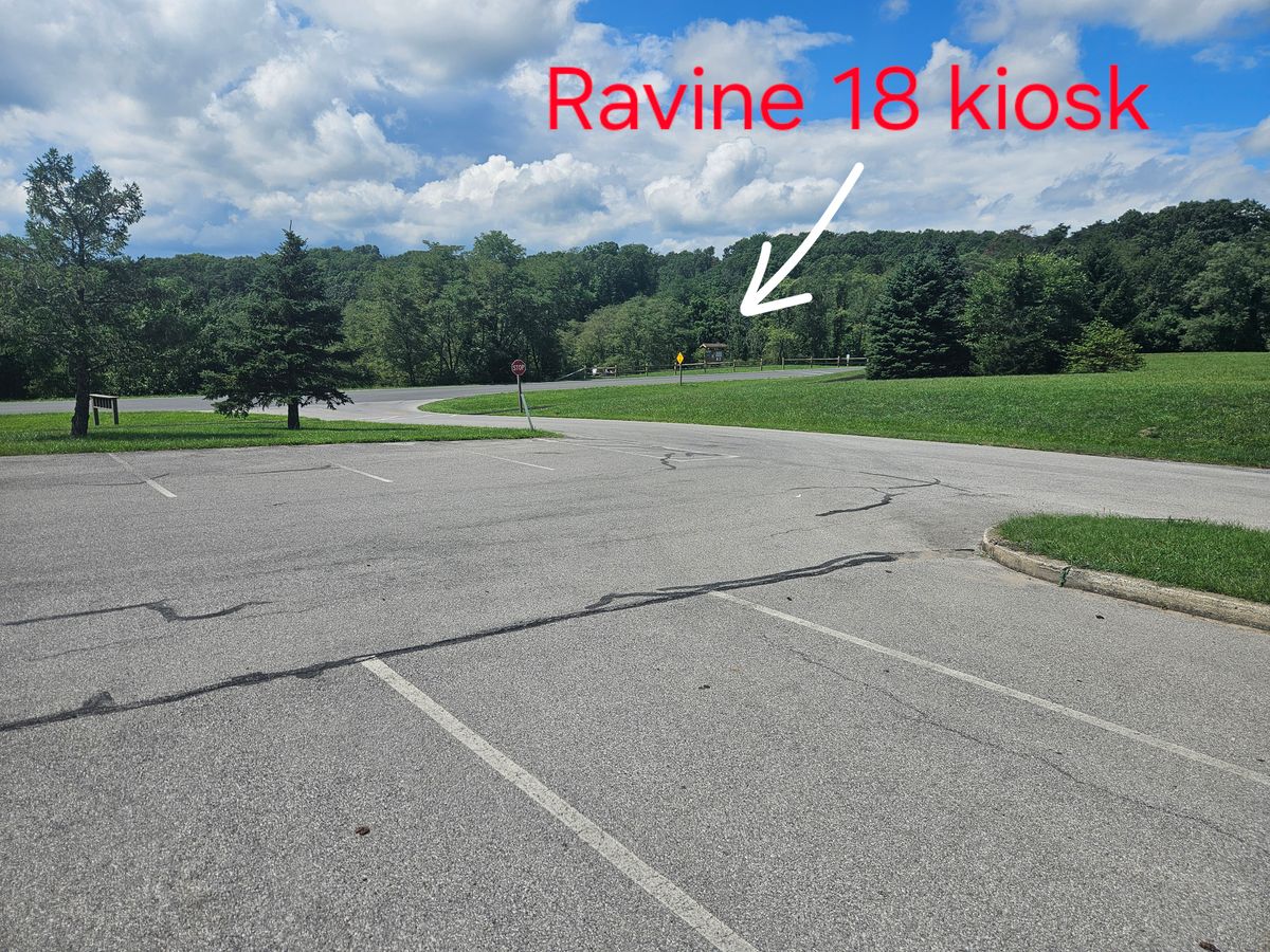 View from north visitor center parking lot looking towards the kiosks,  hole 1 and hole 10