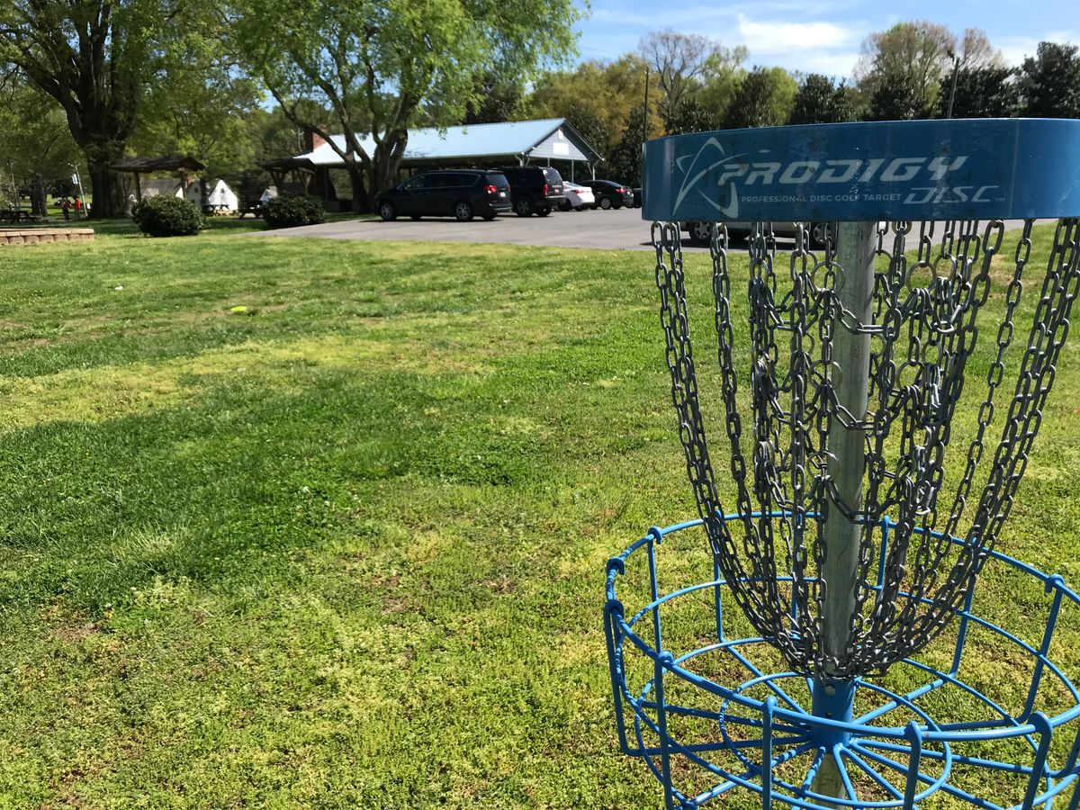 No. 8 basket. Next tee straight ahead right of pavilion. Restrooms available near playground.
