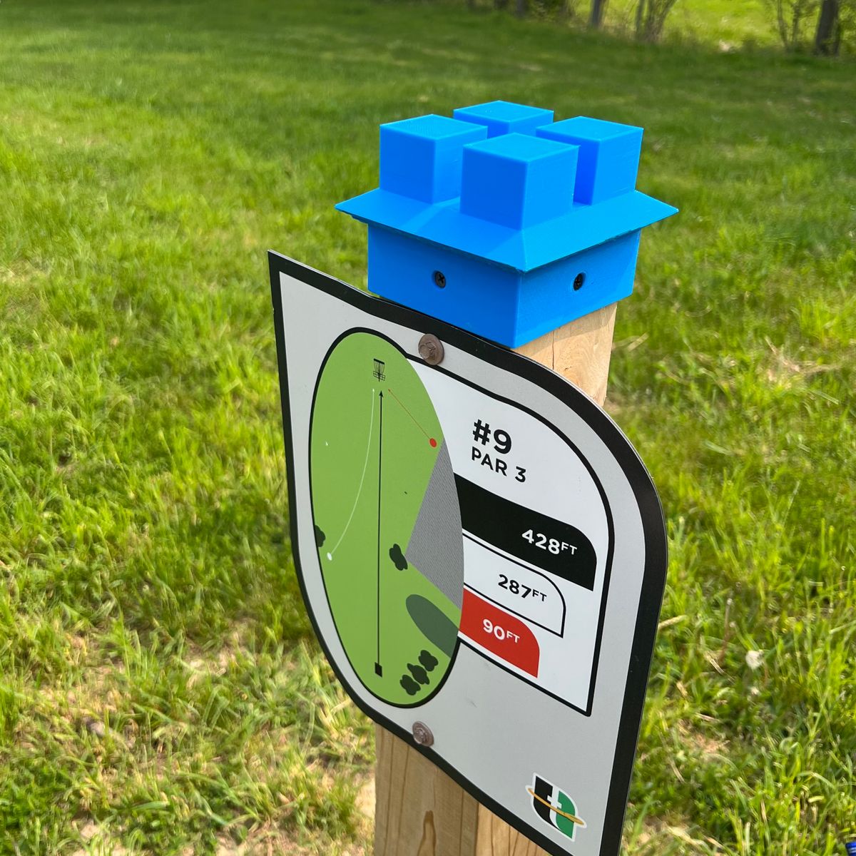 Phone stand cap being installed throughout the course.