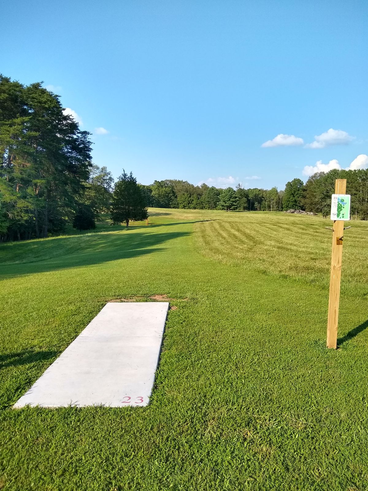 Red tee pad and sign on signature hole #23!