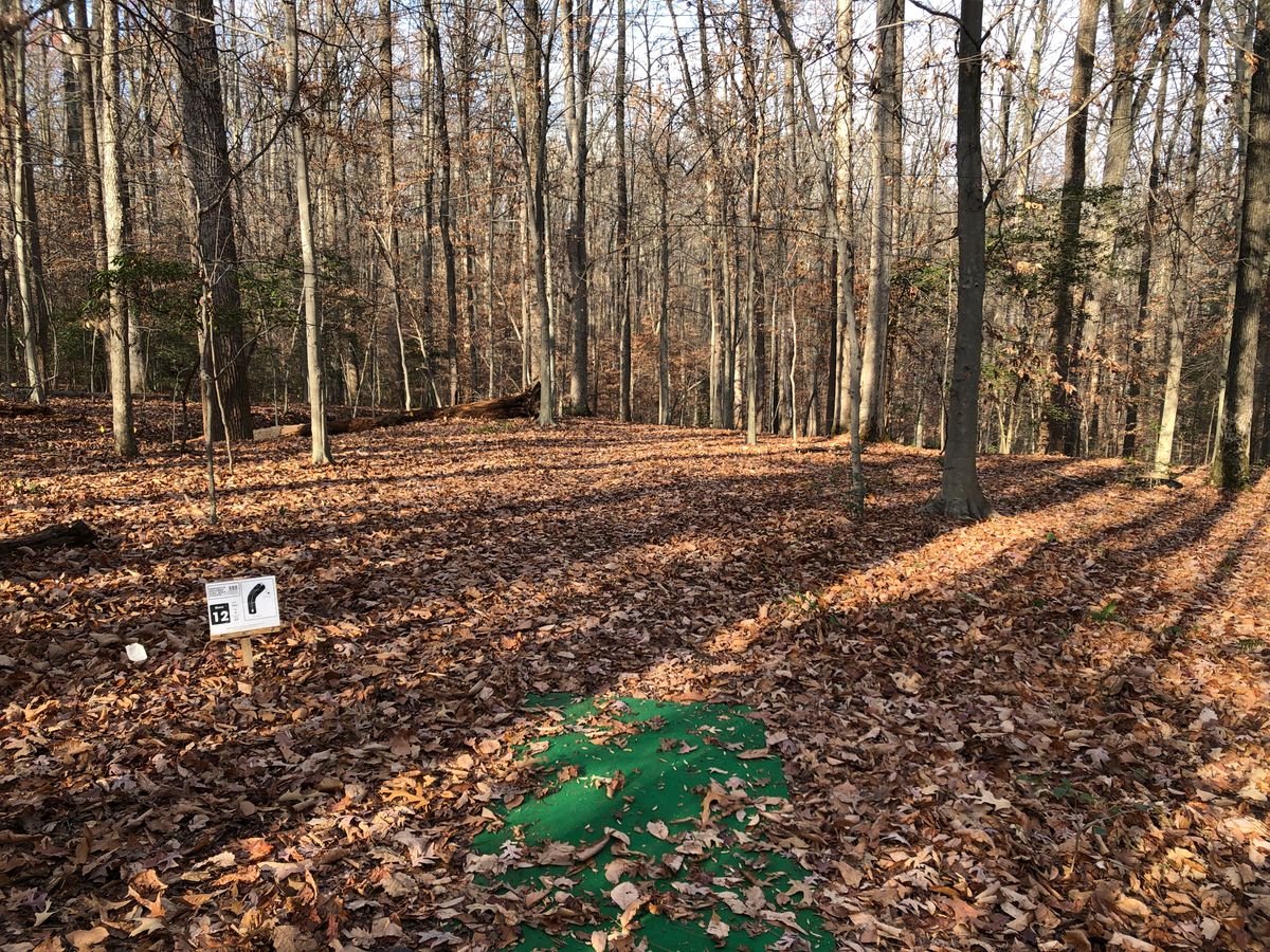 Hole 12 tee (dogleg right and downhill; difficult trenches/ditches on both sides)