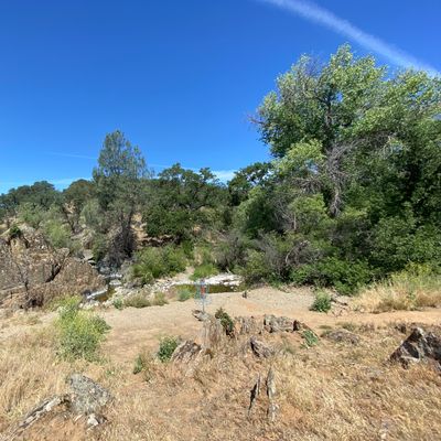 Downhill Green on Hole 6, small creek behind
