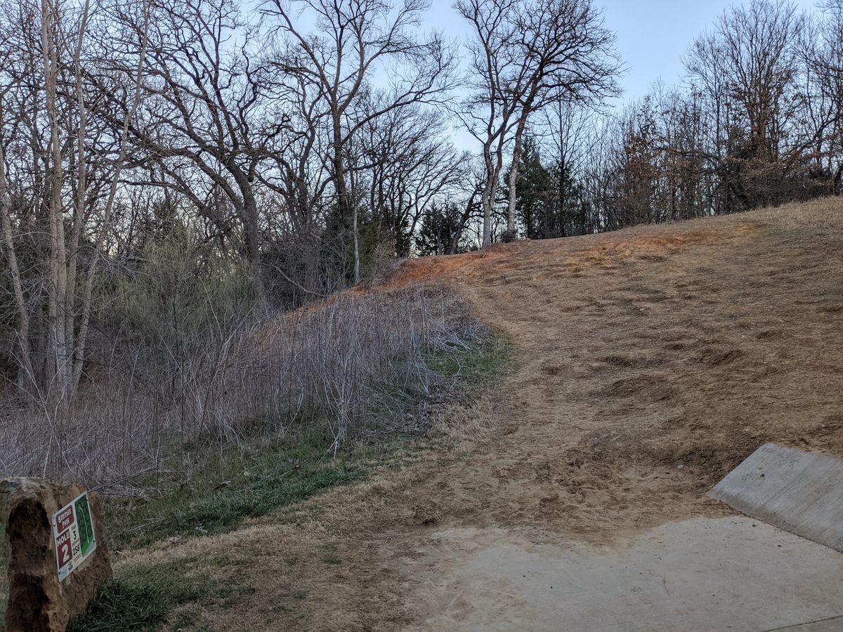 Hole 2 - uphill fairway, dogleg left.