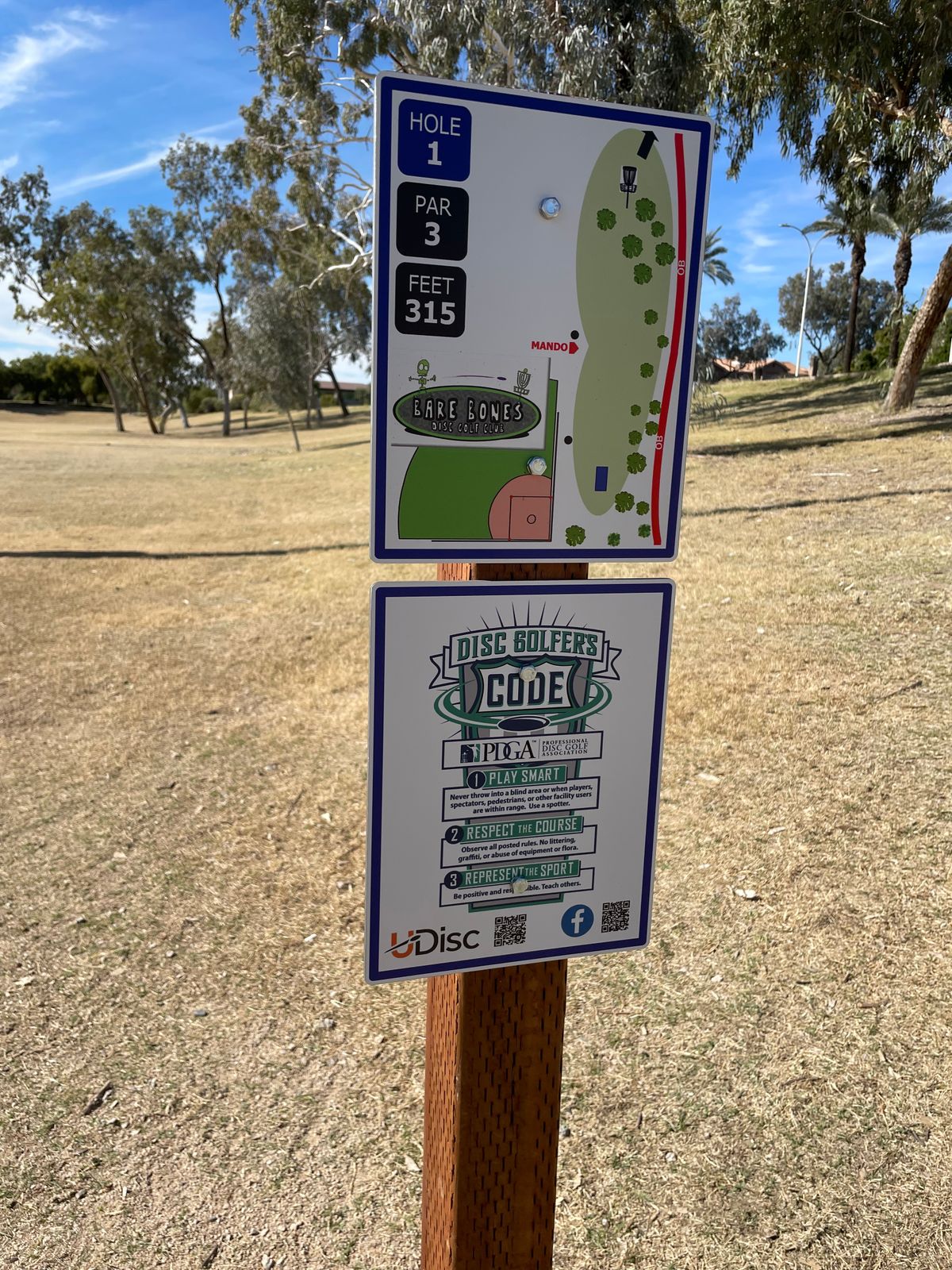 Tee pad #1 directly behind the bathrooms
