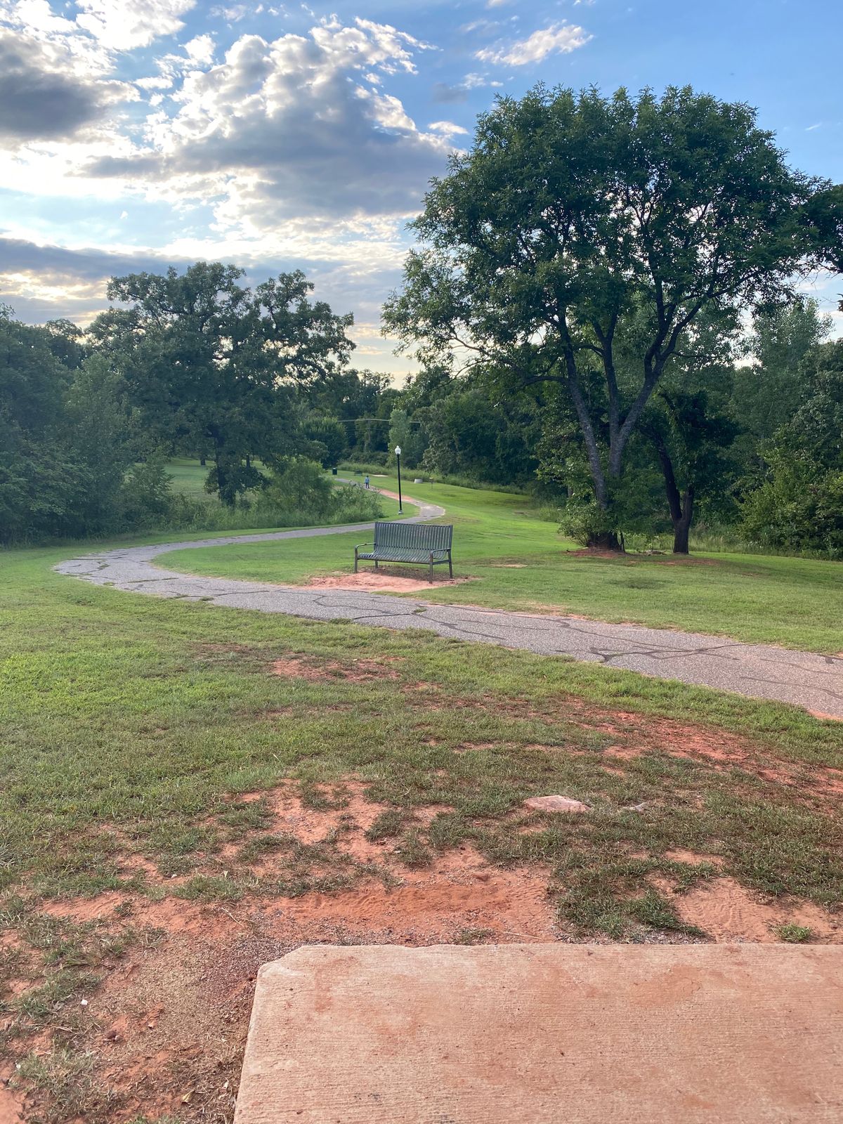 Theirs a dry pond bed off the path on the left side.