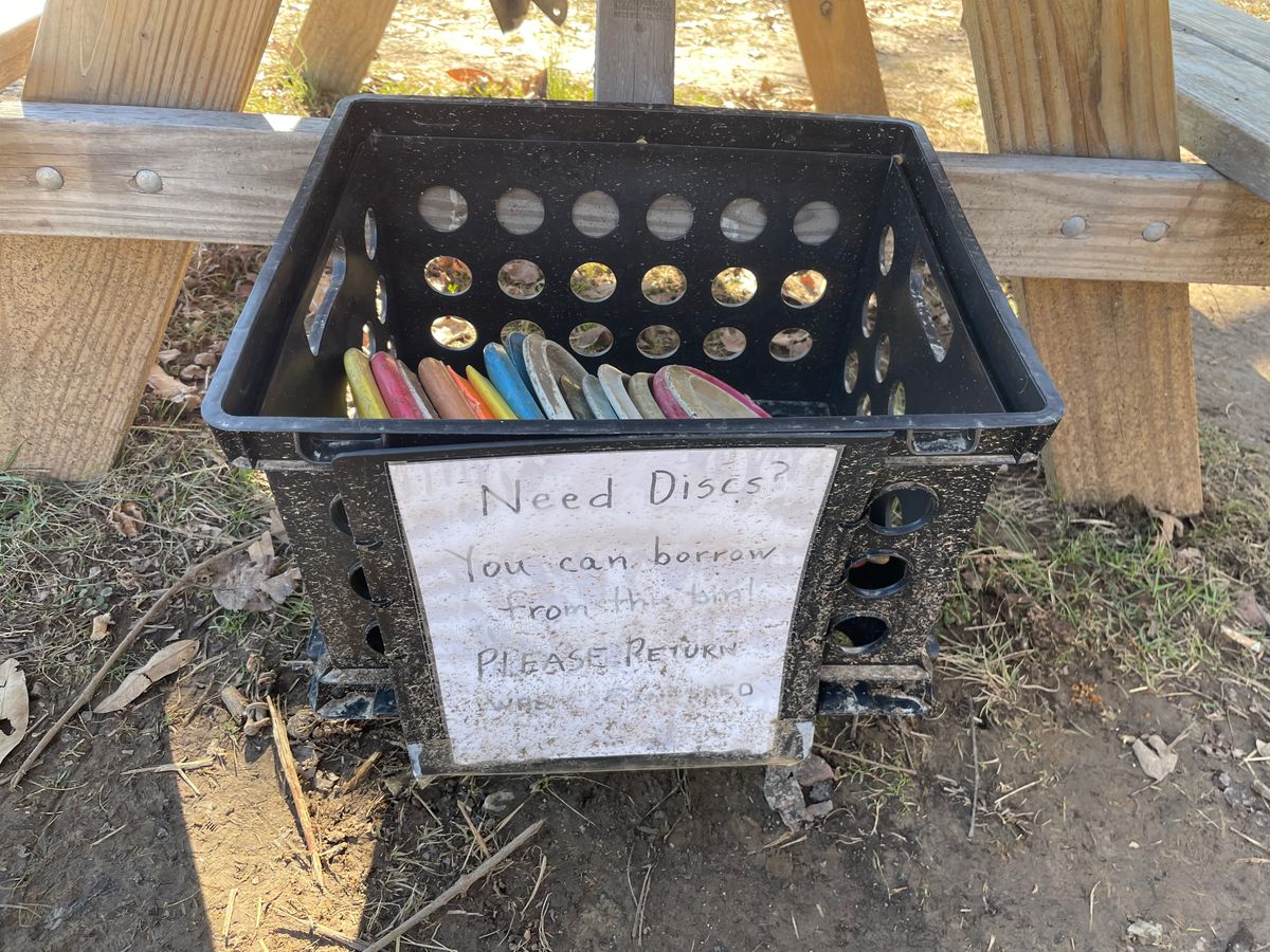 Donated discs on the course that you can burrow during your round.