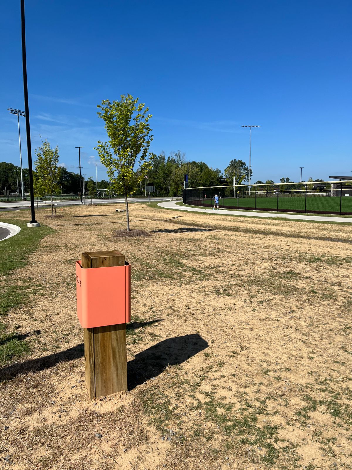 Hole 13: OB: in or over the sidewalk or road. Dangerous shot. The road is busy as is the field.